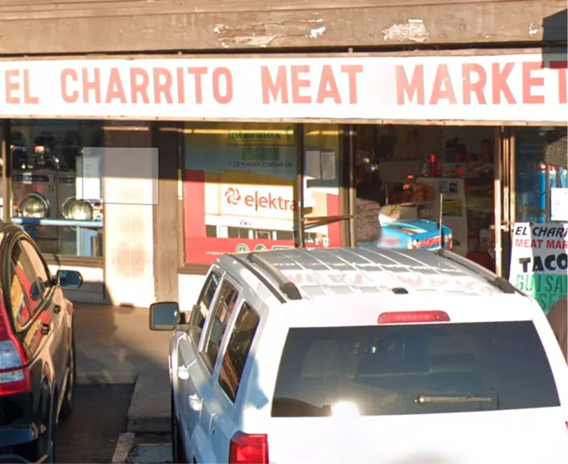 El Charrito Meat Market storefront with entrance and parking area