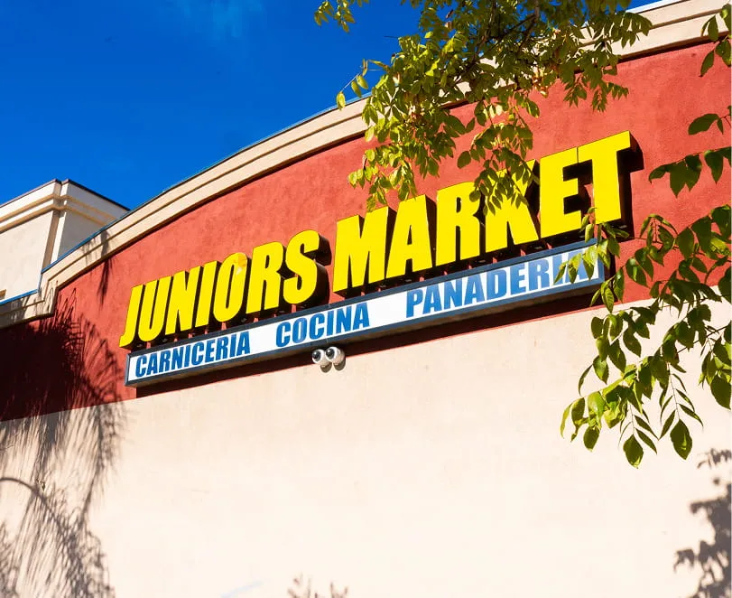 Juniors Market exterior storefront with carniceria cocina and panaderia signage